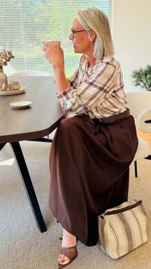 Sophisticated Layers: Plaid Blouse & Deep Brown Skirt